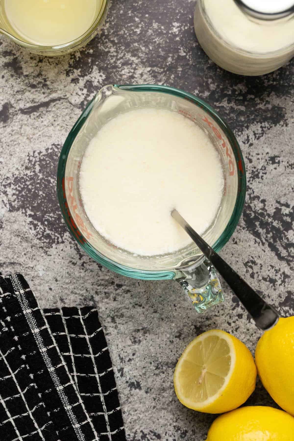 Homemade Buttermilk in a glass measuring jug. 