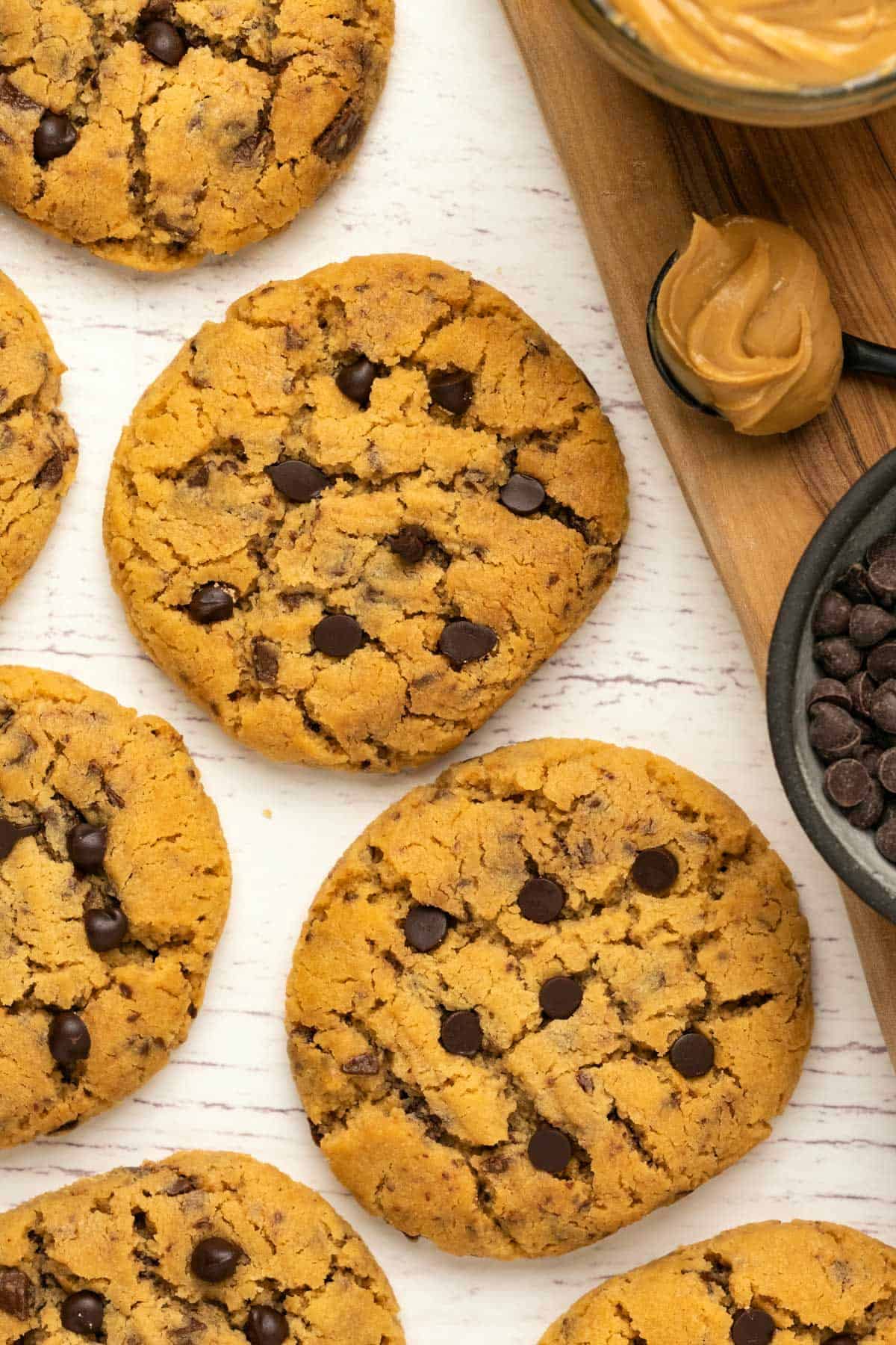 Peanut butter chocolate chip cookies in a row. 