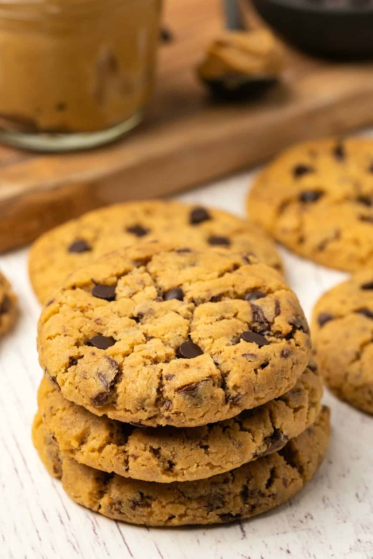 Peanut butter chocolate chip cookies in a stack. 