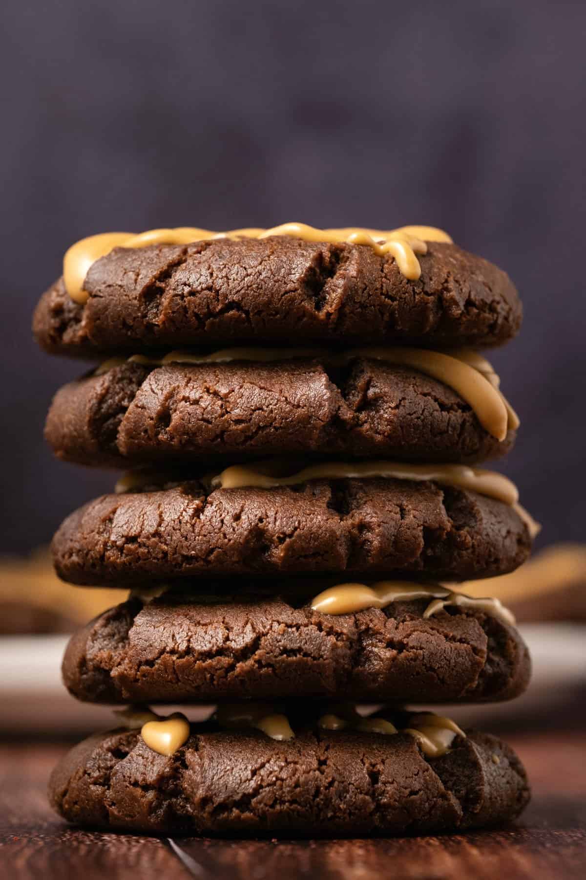 Chocolate peanut butter cookies in a stack. 