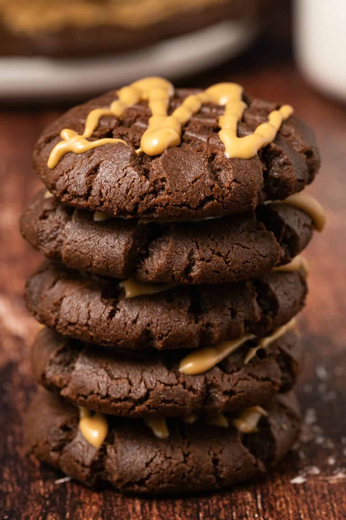 A stack of chocolate peanut butter cookies. 