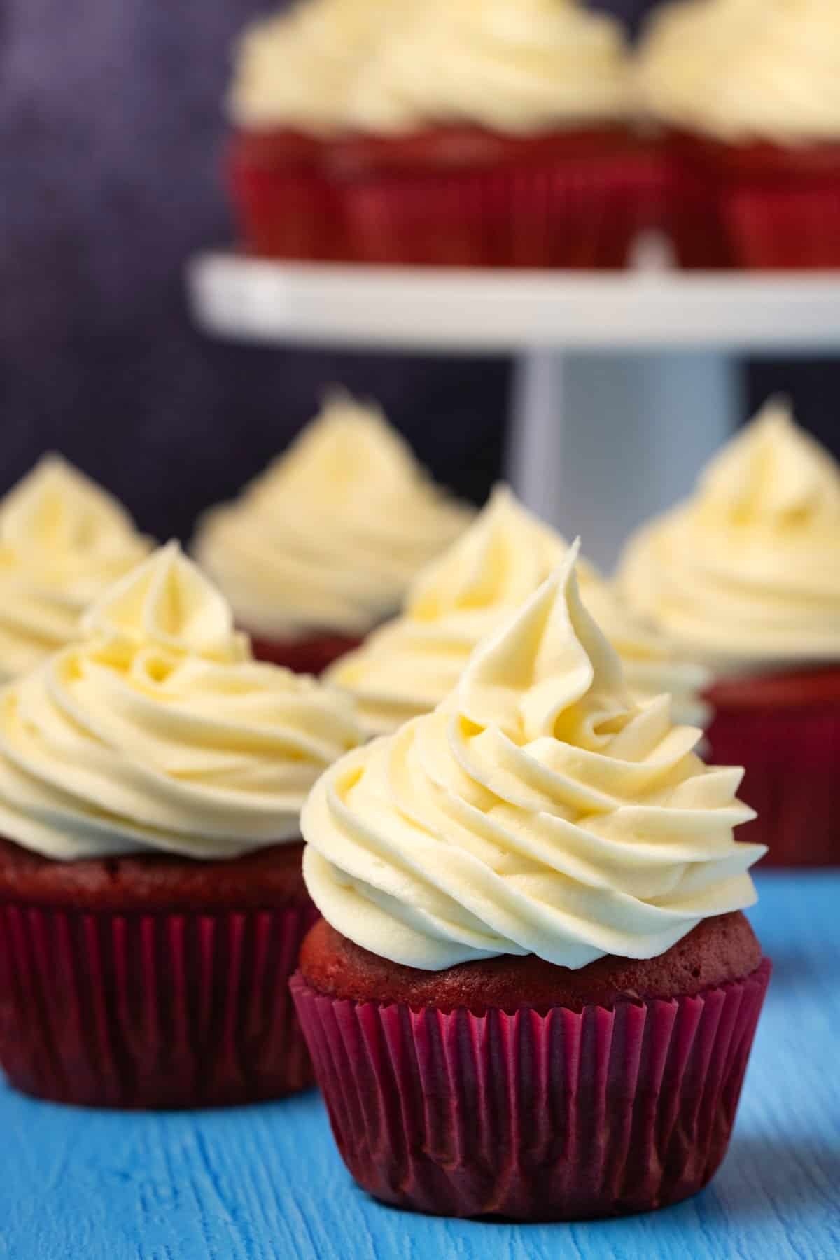 A row of red velvet cupcakes. 