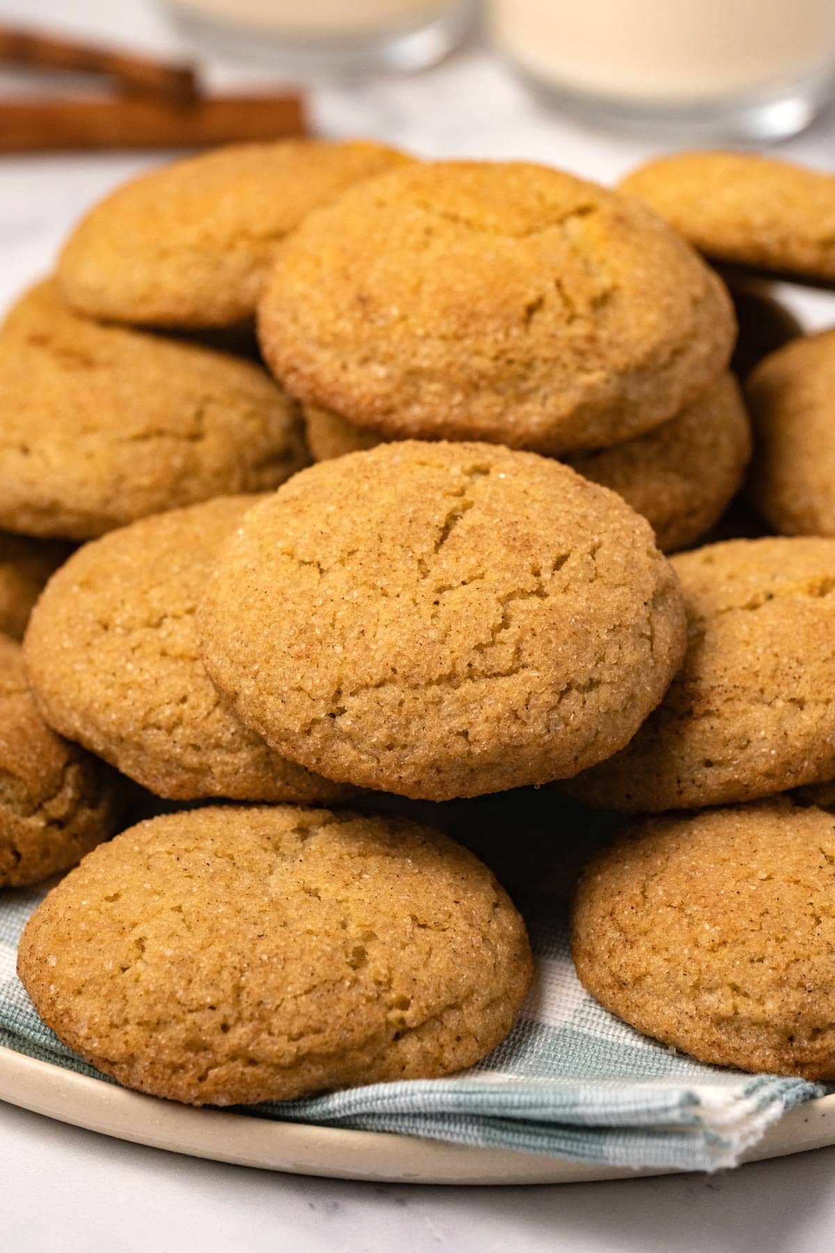 Cookies stacked up on a plate.