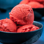 Photo of ice cream scoops in a bowl.