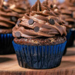 Eggless chocolate cupcakes on a wooden board.