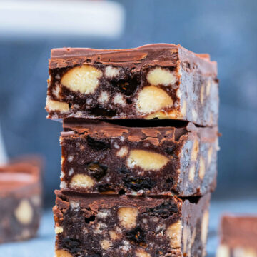 A stack of three chocolate tiffin squares.