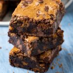 Stack of three biscoff brownies.