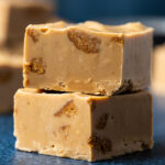 Stack of two squares of biscoff fudge.