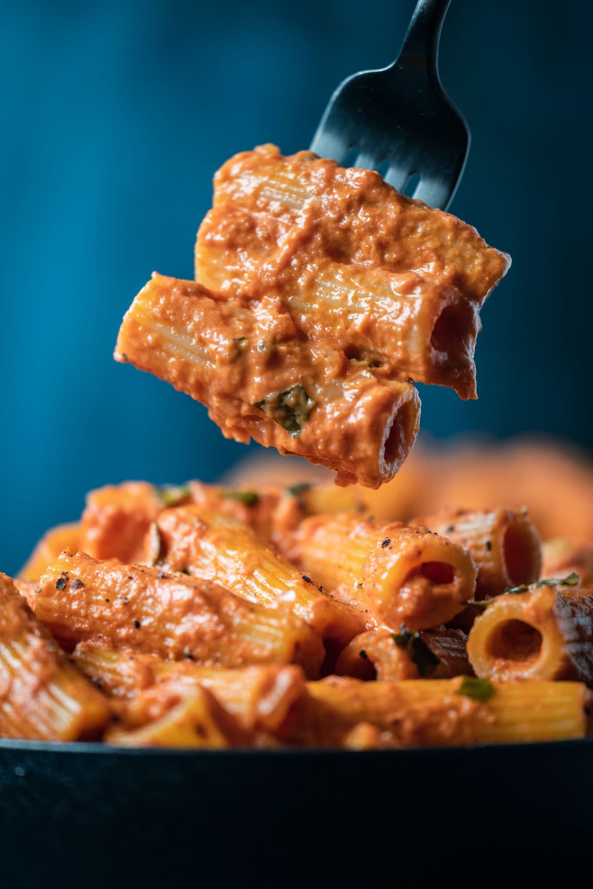 Forkful of spicy rigatoni alla vodka.