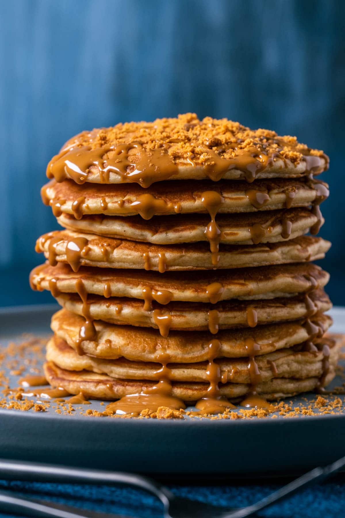 Stack of biscoff pancakes on a gray plate. 