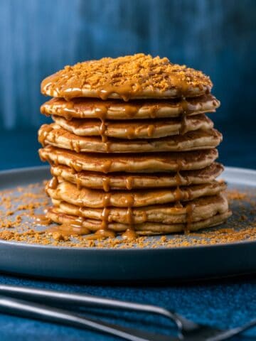 Stack of biscoff pancakes on a gray plate.