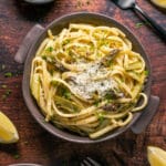 Asparagus pasta topped with parmesan in a bowl.