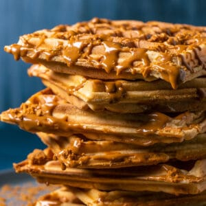 Stack of biscoff waffles on a plate.