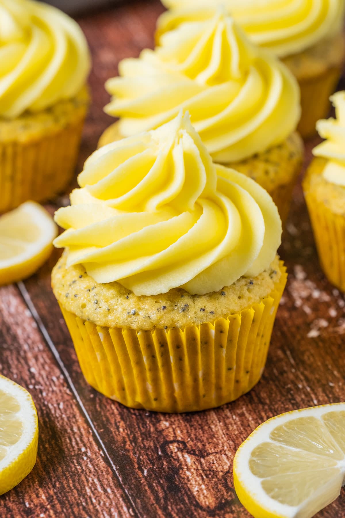 Lemon poppy seed cupcakes and lemon slices.