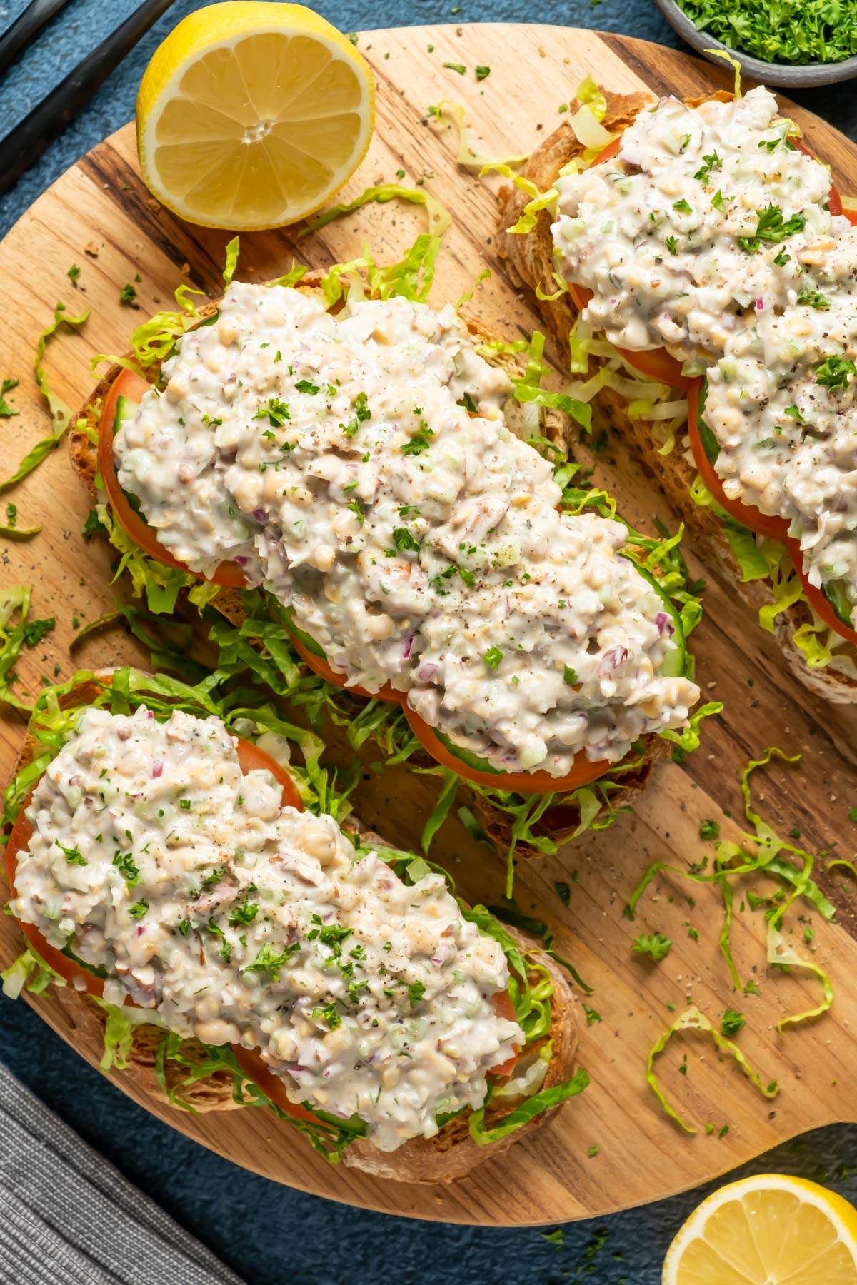 Chickpea chicken salad on open faced sandwiches. 