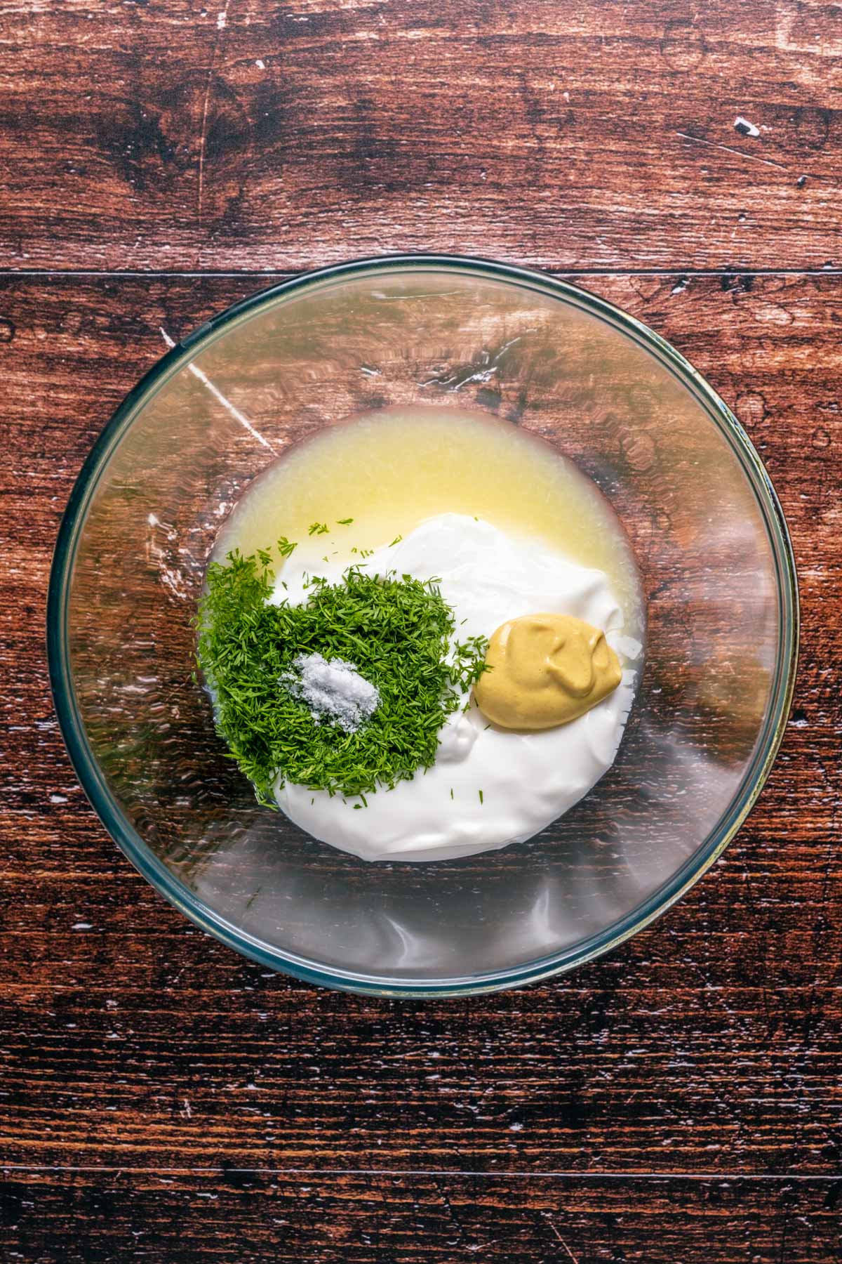 Aioli ingredients added to mixing bowl.
