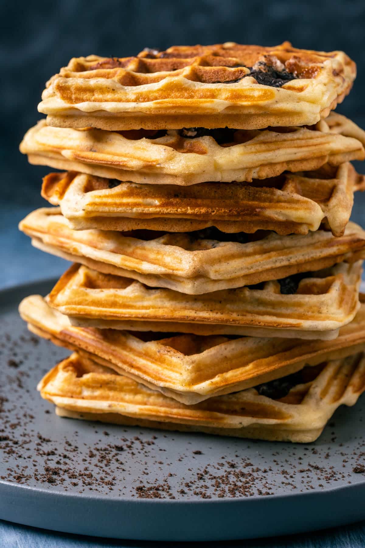 Oreo waffles stacked on a gray plate.