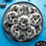 Oreo donuts stacked on a grey plate